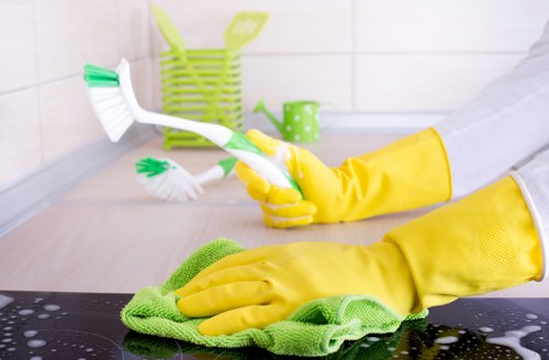 Detailed post-construction cleaning of kitchen surfaces and cabinets